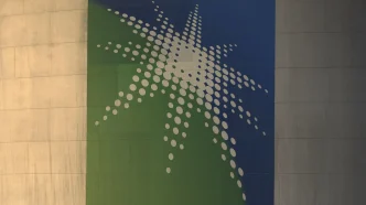 Abstract wall mural with a white dotted starburst on a blue and green panel.