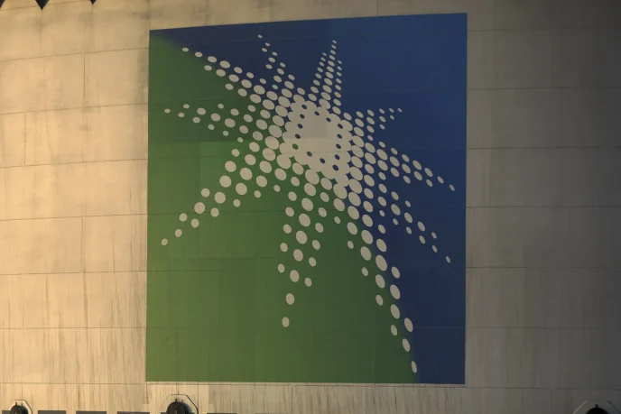 Abstract wall mural with a white dotted starburst on a blue and green panel.