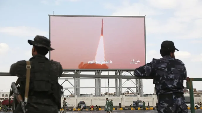 Armed fighters watching a missile launch displayed on a large screen