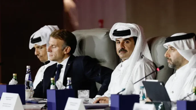 Qatar Emir Sheikh Tamim bin Hamad Al Thani and French President Macron seated at a meeting table
